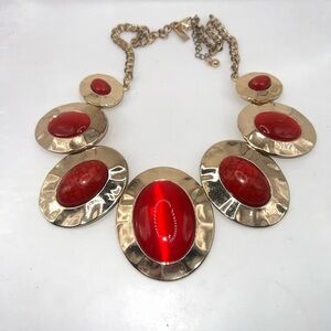 INC Red Cabochon faux stones set in a gold tone setting with gold chain
